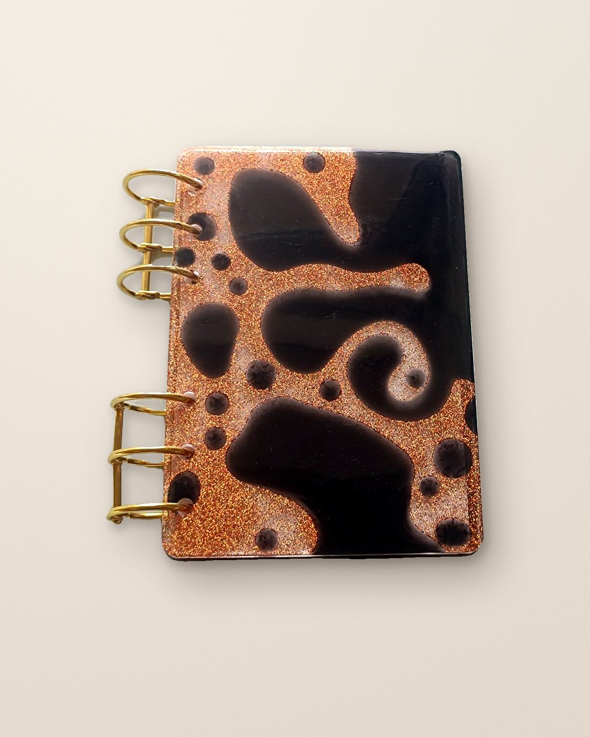 Copper and black resin diary with gold rings
