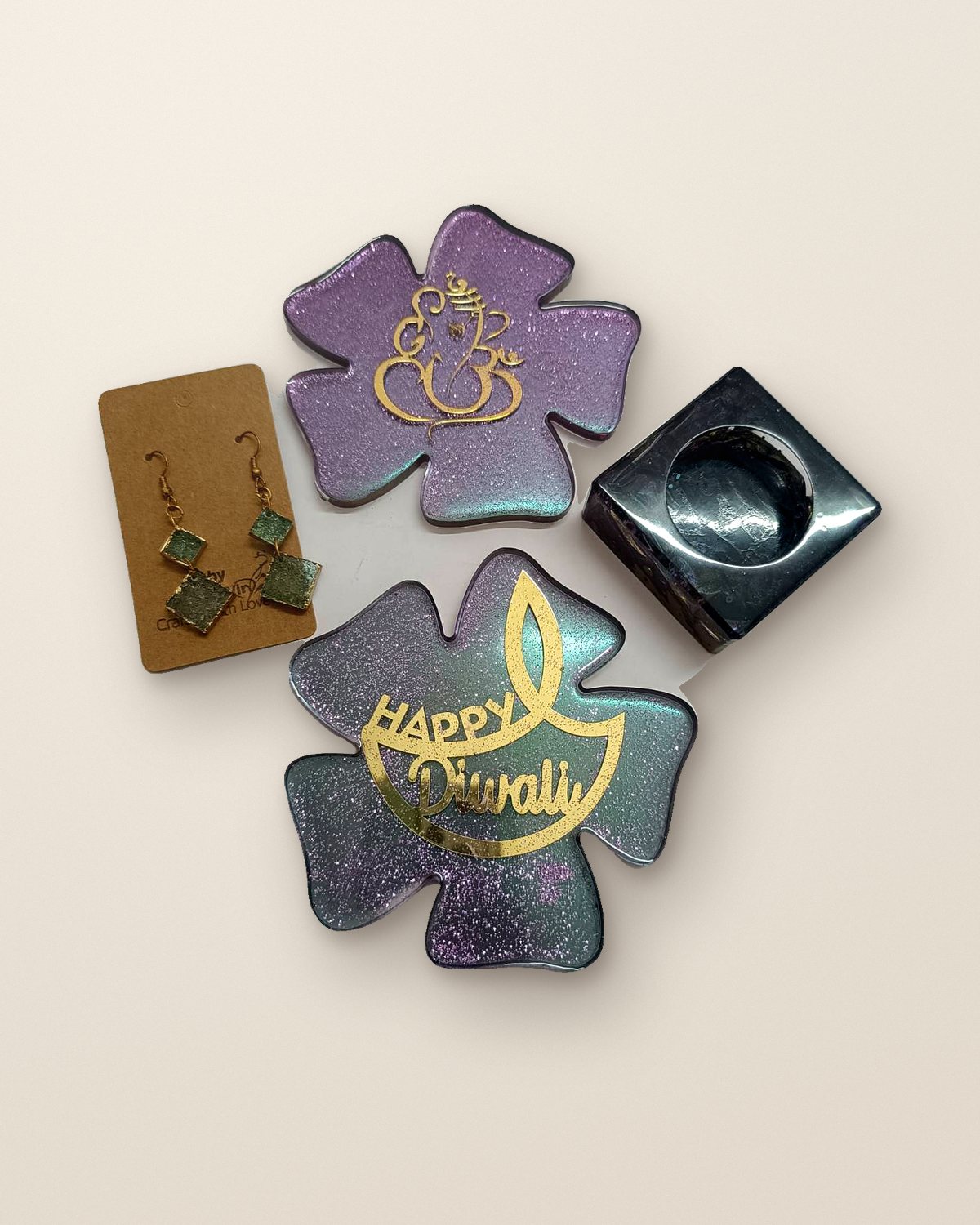 Violet and silver Diwali resin set with flower platters, a tealight holder and earrings