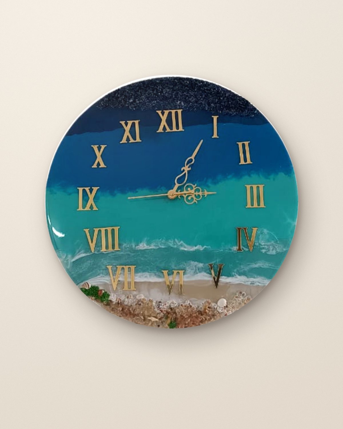 Ocean resin wall clock in teal and navy with gold numerals